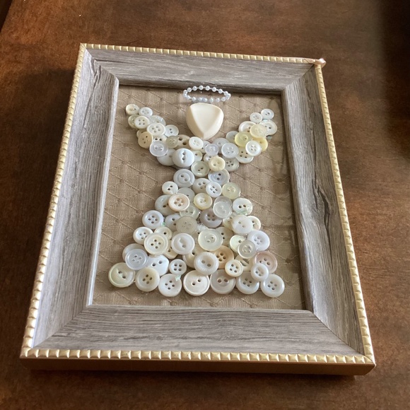 Button angel in frame. Gold fabric background. Wood like frame with gold trim. - Picture 3 of 5